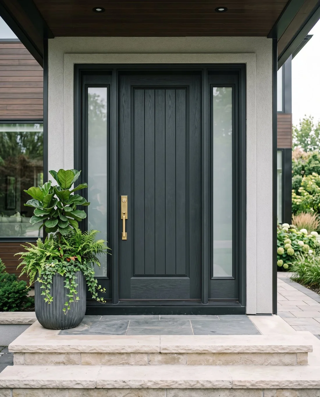 A black fibreglass entry door on a contemporary Canadian home